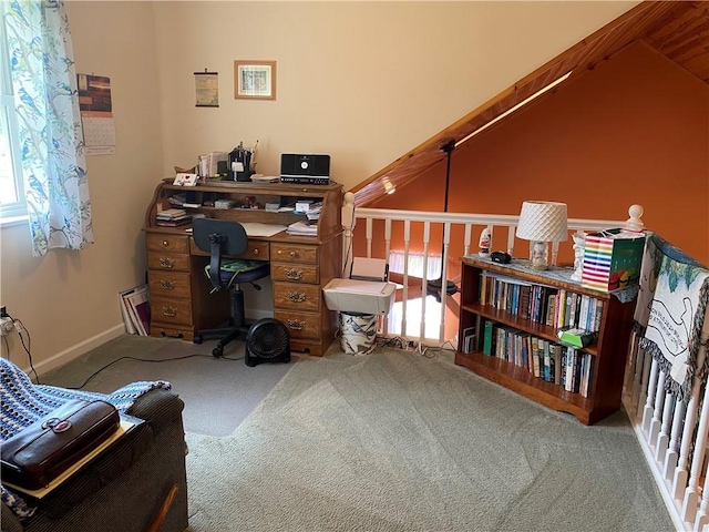 office with lofted ceiling and carpet floors