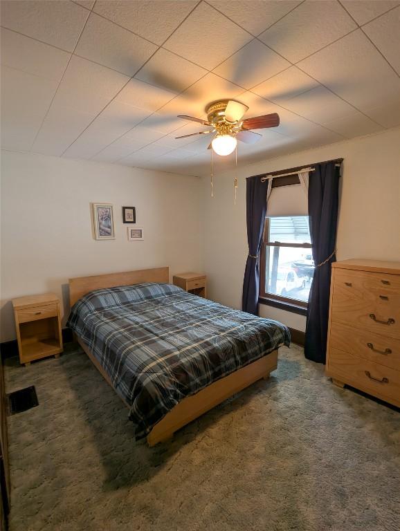 carpeted bedroom with ceiling fan