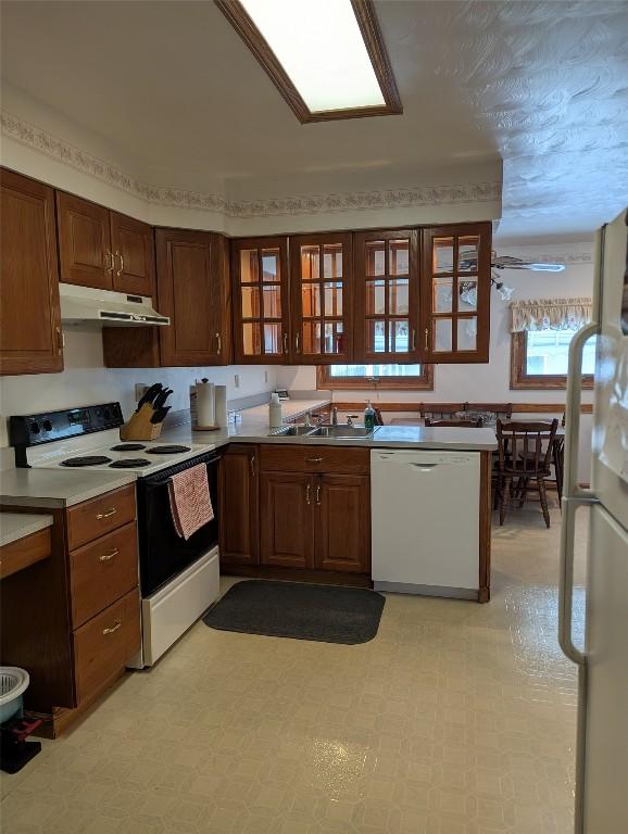 kitchen with white appliances and sink