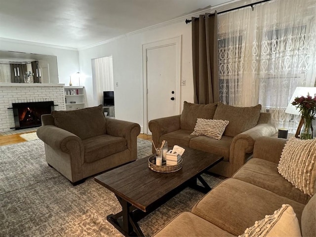 living room with a brick fireplace and ornamental molding