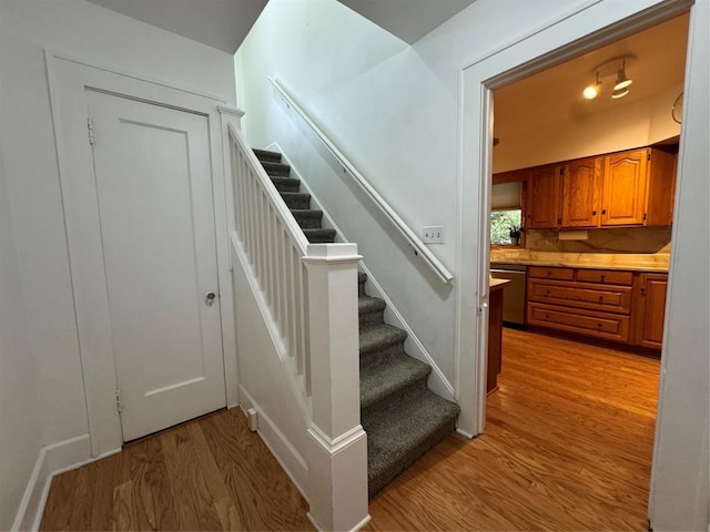 staircase featuring hardwood / wood-style flooring