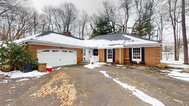 ranch-style home with a garage