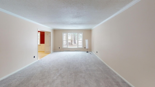 unfurnished room featuring light colored carpet, ornamental molding, and a textured ceiling