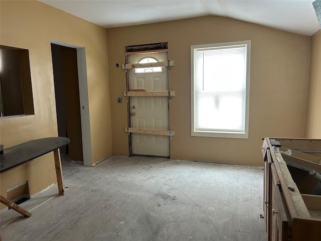 entrance foyer featuring lofted ceiling