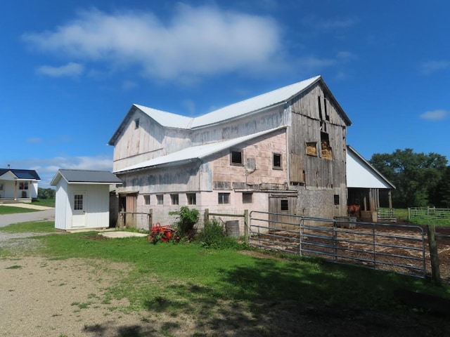 view of side of home with an outbuilding