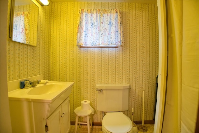 12199 Mantor St, Conneaut Lake, PA 16316 - bathroom with vanity, wallpapered walls, and toilet