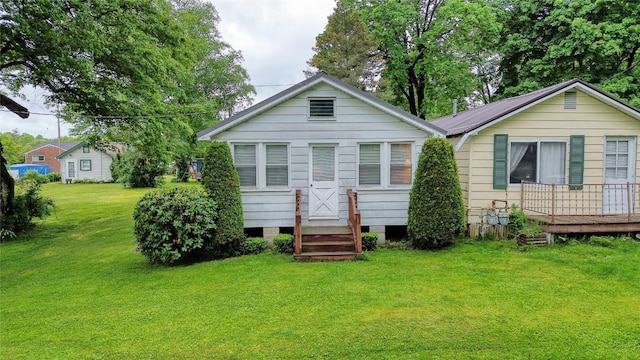 12199 Mantor St, Conneaut Lake, PA 16316 - rear view of property featuring a lawn