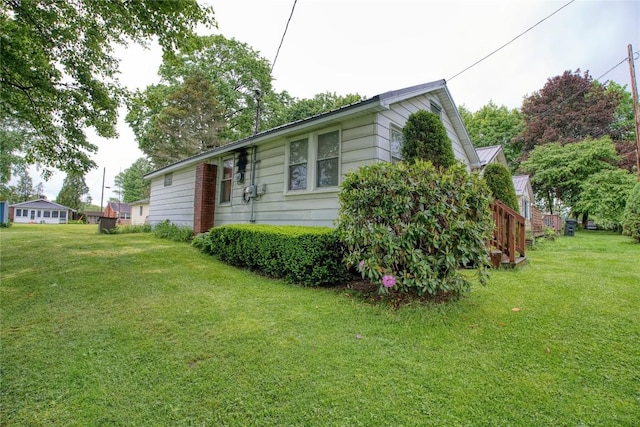 12199 Mantor St, Conneaut Lake, PA 16316 - view of property exterior with a lawn