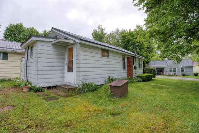 12199 Mantor St, Conneaut Lake, PA 16316 - view of front of property with metal roof and a front yard