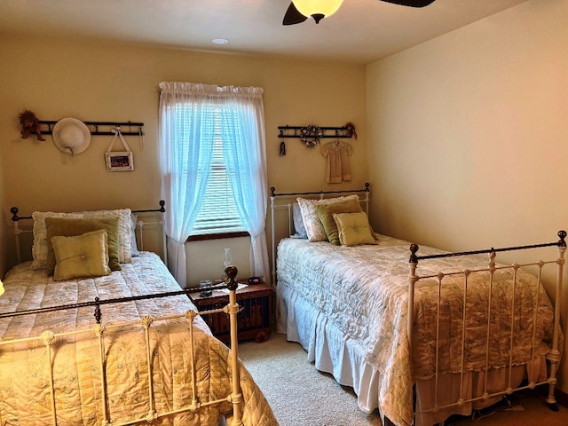 carpeted bedroom featuring a ceiling fan