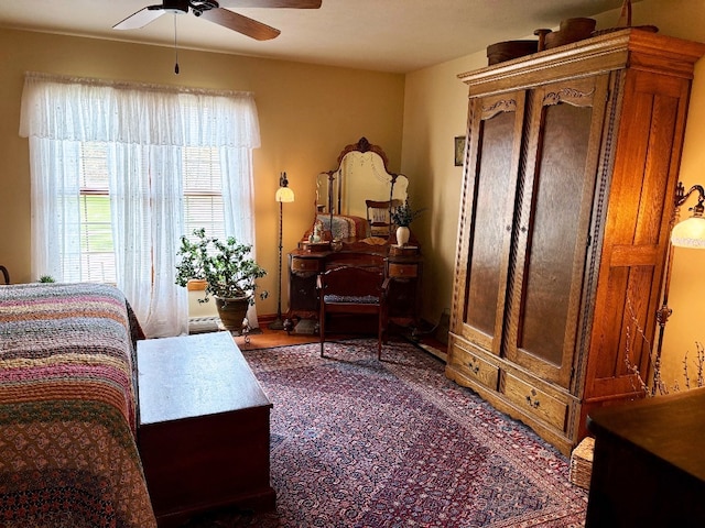 bedroom featuring ceiling fan and baseboards