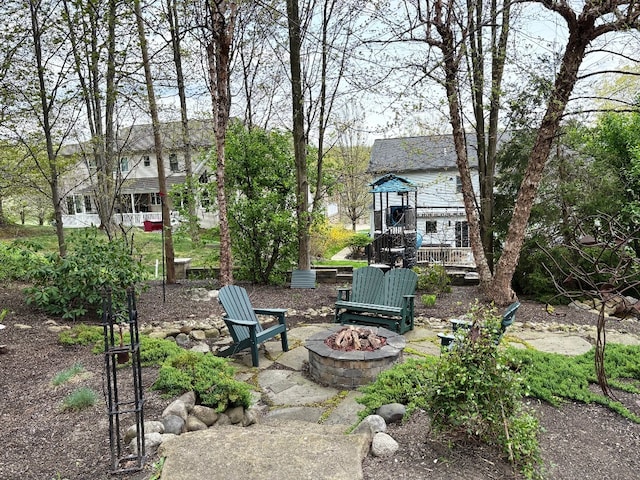 view of yard with a fire pit and a wooden deck
