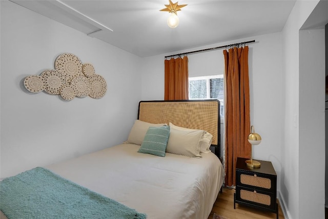 bedroom featuring wood finished floors