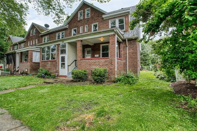 1032 Newton Ave, Erie, PA 16511 - view of front of property featuring brick siding and a front lawn