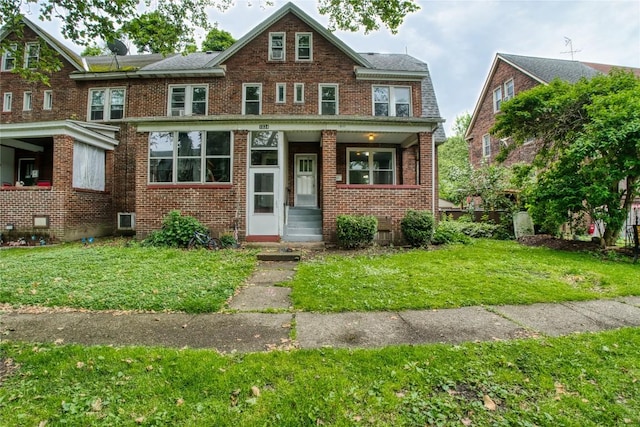 1032 Newton Ave, Erie, PA 16511 - view of property featuring a front yard, brick siding, and covered porch