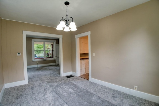 1032 Newton Ave, Erie, PA 16511 - spare room with carpet floors and a chandelier