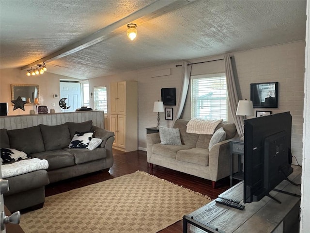 living room featuring a textured ceiling, lofted ceiling with beams, and dark wood finished floors