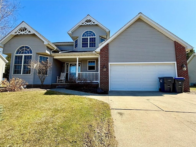 view of front of property with a front yard, a porch, concrete driveway, and an attached garage