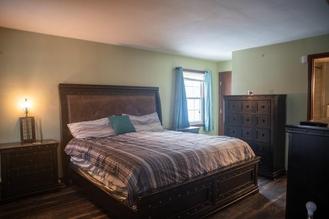 bedroom featuring dark wood-type flooring