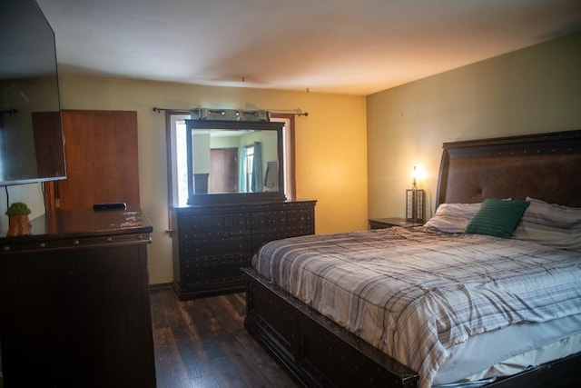 bedroom featuring dark wood-type flooring