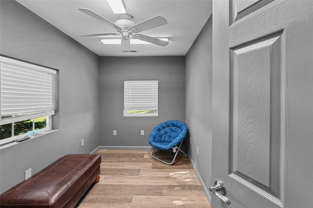 11221 W Greene Rd, Waterford, PA 16441 - sitting room featuring wood finished floors, ceiling fan, and baseboards