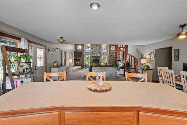 11221 W Greene Rd, Waterford, PA 16441 - kitchen featuring open floor plan, a stone fireplace, and light countertops