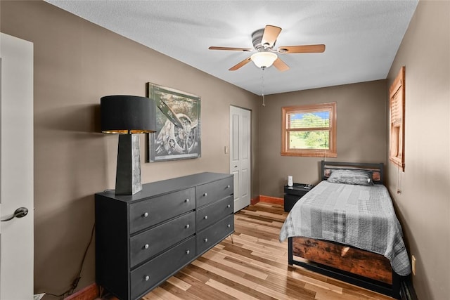 11221 W Greene Rd, Waterford, PA 16441 - bedroom with light wood-style flooring, baseboards, and a ceiling fan