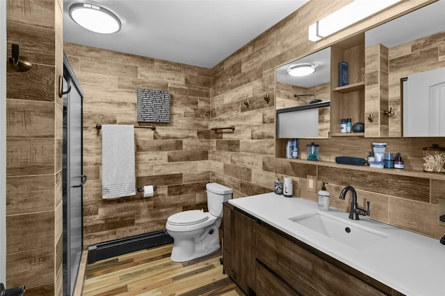 11221 W Greene Rd, Waterford, PA 16441 - full bath featuring toilet, a stall shower, vanity, wood finished floors, and tile walls