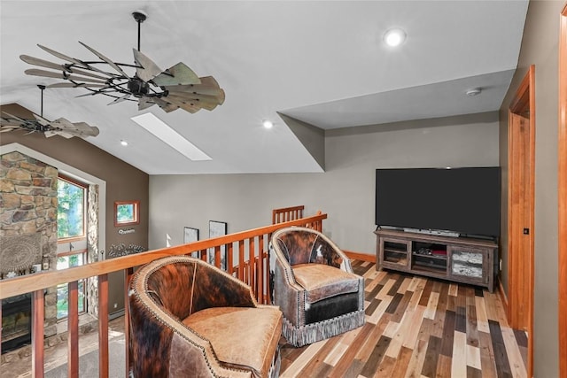 11221 W Greene Rd, Waterford, PA 16441 - living area featuring lofted ceiling, a skylight, ceiling fan, wood finished floors, and recessed lighting