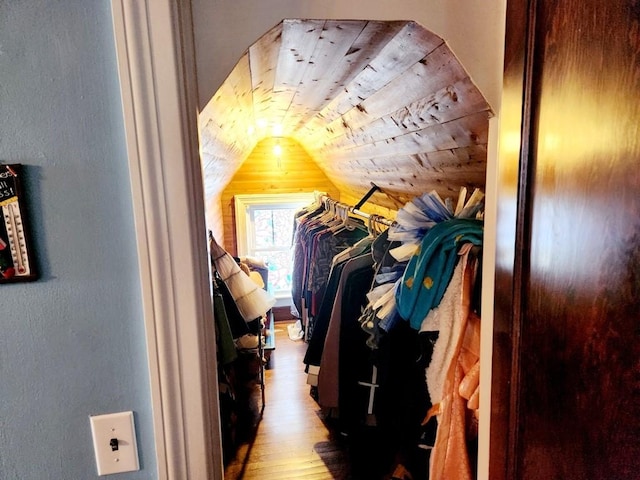 interior space featuring hardwood / wood-style floors and vaulted ceiling