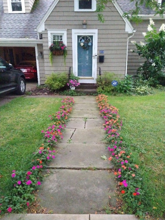 entrance to property with a yard