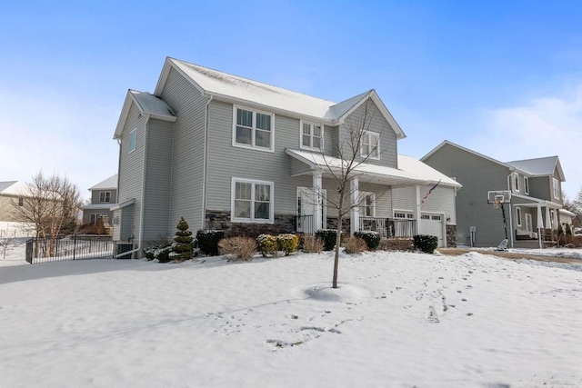 snow covered house with a porch