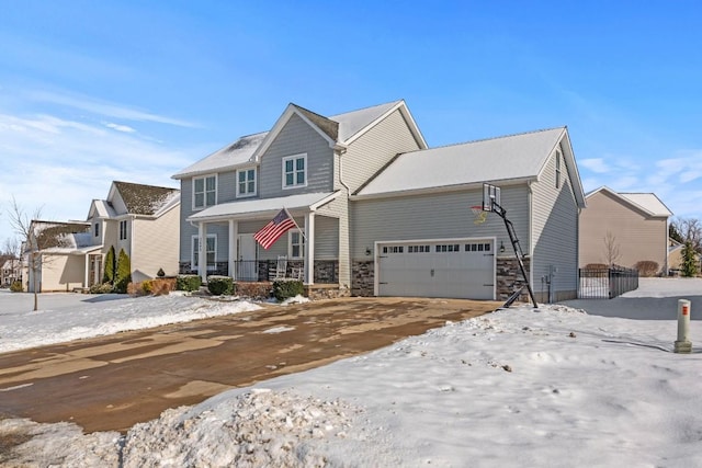 view of front of property featuring a garage and covered porch