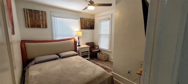 bedroom featuring ceiling fan and wood-type flooring