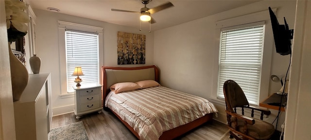 bedroom featuring ceiling fan and dark hardwood / wood-style flooring