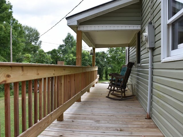 wooden terrace featuring covered porch