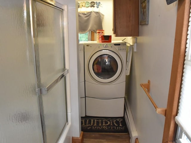 laundry room with plenty of natural light, cabinets, and washer / dryer