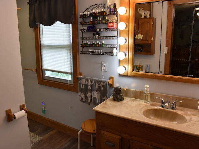 bathroom featuring hardwood / wood-style floors and vanity