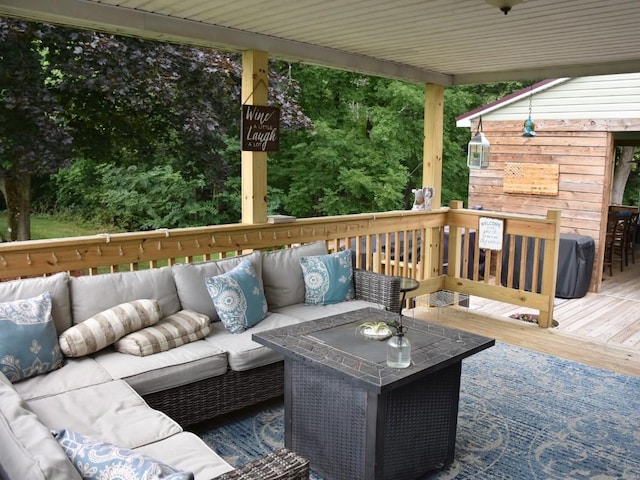 wooden deck with outdoor lounge area