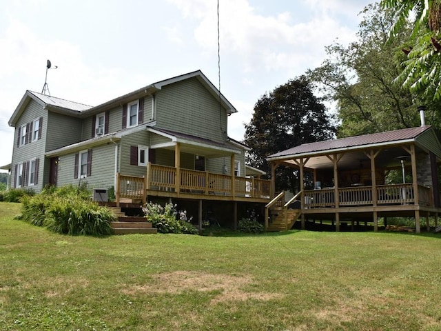 rear view of house with a yard