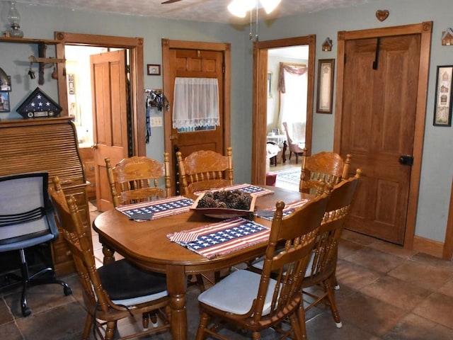 dining space featuring ceiling fan