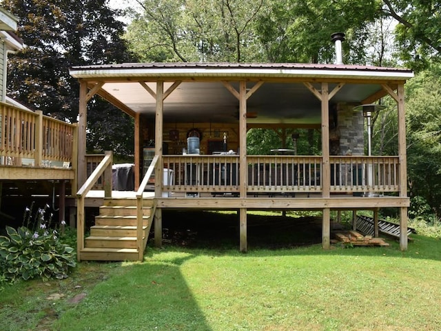 back of property featuring a yard and a wooden deck