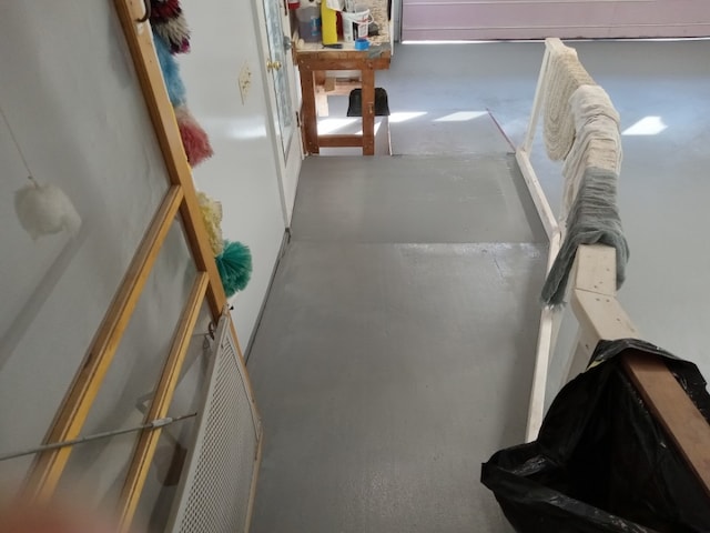 hallway with concrete flooring