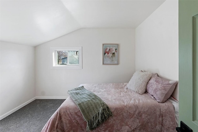 carpeted bedroom with lofted ceiling