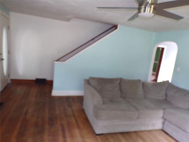 13326 Ridge Rd, West Springfield, PA 16443 - living room featuring wood finished floors, a ceiling fan, stairs, and arched walkways