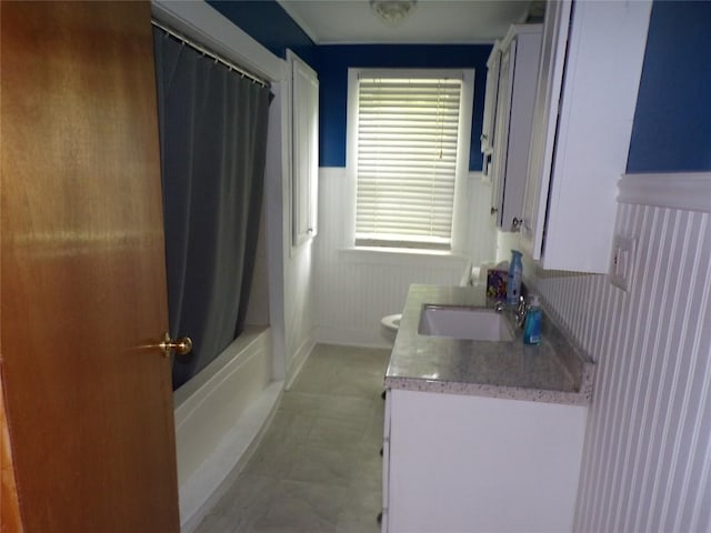 13326 Ridge Rd, West Springfield, PA 16443 - bathroom featuring a wainscoted wall, toilet, vanity, and shower / bath combo