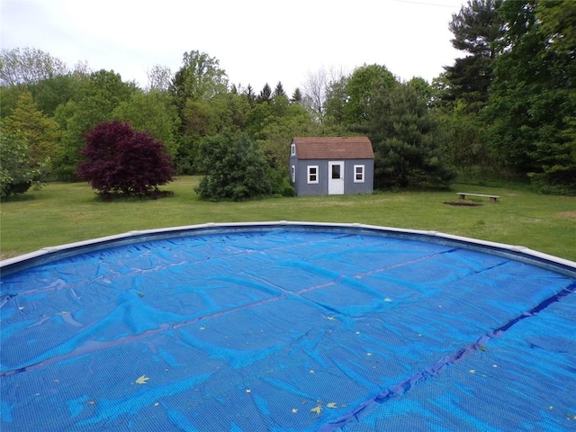 13326 Ridge Rd, West Springfield, PA 16443 - view of swimming pool with a covered pool, an outbuilding, and a lawn