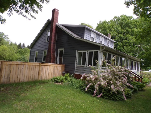 13326 Ridge Rd, West Springfield, PA 16443 - back of property featuring a chimney and a sunroom