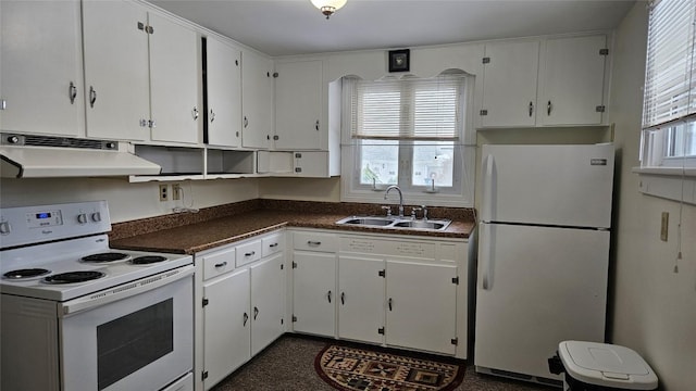 kitchen featuring sink, white appliances, and white cabinets