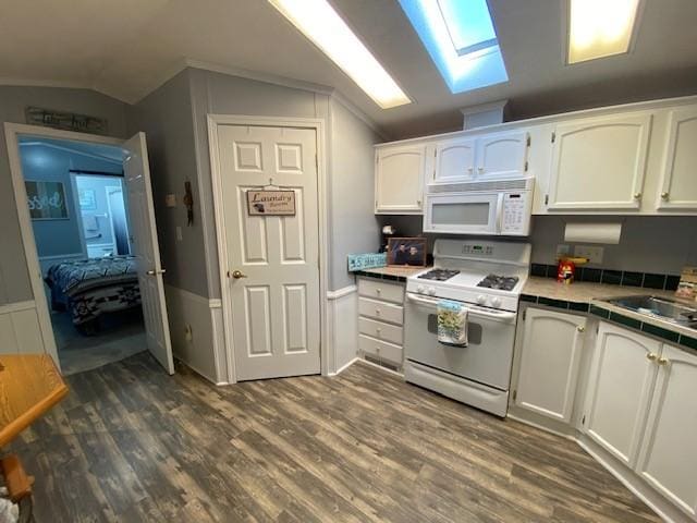 831 Douglas Dr, Erie, PA 16505 - kitchen featuring white appliances, vaulted ceiling, dark wood-style flooring, white cabinetry, and a skylight